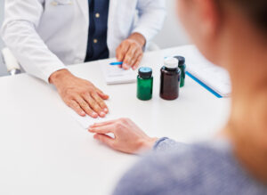 Close up of patient giving doctor a bribe